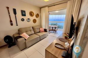 a living room with a couch and a table at N1605 Vista Mar Nautilus Beto Carrero in Penha