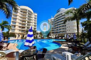a swimming pool in the middle of a resort at N1605 Vista Mar Nautilus Beto Carrero in Penha