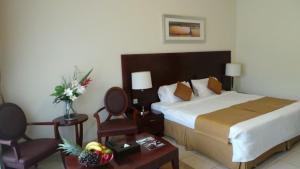 Postel nebo postele na pokoji v ubytování Akas-Inn Hotel Apartment