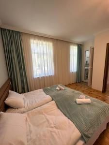 Posteľ alebo postele v izbe v ubytovaní Polaris Kazbegi
