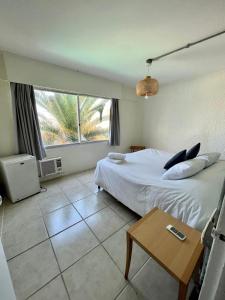 Cama ou camas em um quarto em ZAG Coliving Punta del este