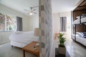 Cama ou camas em um quarto em ZAG Coliving Punta del este