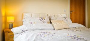 A bed or beds in a room at Ben Haven Self Catering Accommodation