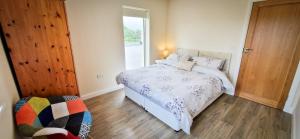 A bed or beds in a room at Ben Haven Self Catering Accommodation