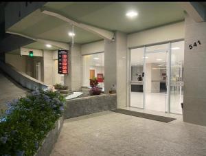 a lobby of a building with a entrance with a sign at AP confortável e bem localizado in Vitória