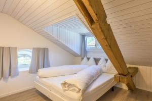 Postel nebo postele na pokoji v ubytování Hotel Buna luna by Seehof Laax