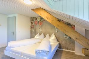 Postel nebo postele na pokoji v ubytování Hotel Buna luna by Seehof Laax