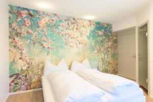 Postel nebo postele na pokoji v ubytování Hotel Buna luna by Seehof Laax
