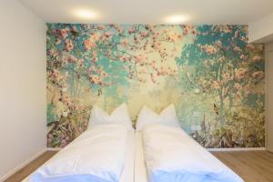 Postel nebo postele na pokoji v ubytování Hotel Buna luna by Seehof Laax