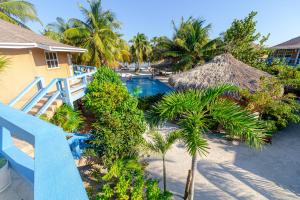 an aerial view of a resort with a swimming pool at White Sands Cove G04- Partial Ocean View 1 BR by Stay Floreo in San Pedro