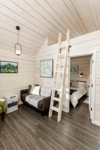 a bedroom with a bunk bed and a ladder at BlueWater BaseCamp in Anchorage