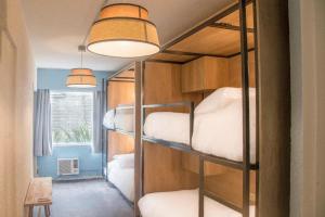 Cama ou camas em um quarto em ZAG Coliving Punta del este