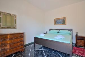 Postel nebo postele na pokoji v ubytování Nel Verde Family Suite