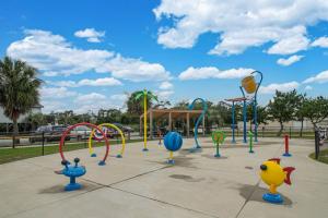 a playground with colorful playground equipment in a park at The Hairy Crab in Oak Island