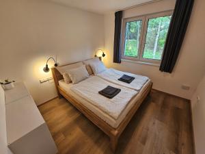 Postel nebo postele na pokoji v ubytování Apartmán v tichu