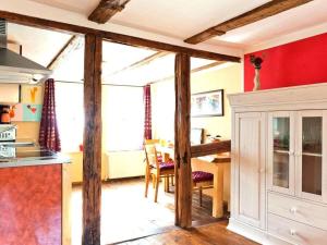 a kitchen with a table and a dining room at Holiday apartment sunshine in Quedlinburg