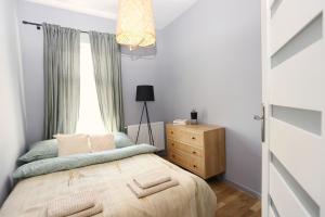 Postel nebo postele na pokoji v ubytování Apartament Sudeckie Boho