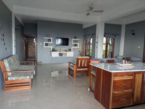 a living room with a couch and a table and chairs at Desired View in Choiseul
