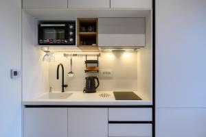 Kuchyň nebo kuchyňský kout v ubytování Modular Sea view Spa Studio