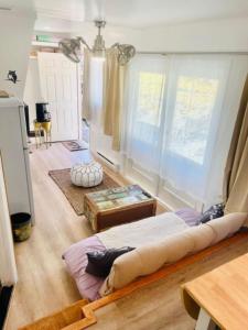 a bedroom with a large bed in a room at Catskill Cabin Little Owl Apt 1 in Shandaken +18 photos