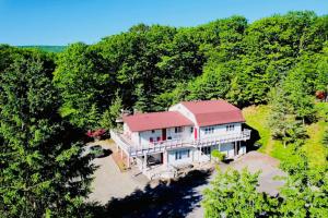an aerial view of a house in the woods at Catskill Cabin Little Owl Apt 1 in Shandaken