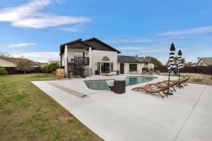 a house with a swimming pool in a yard at Lux Fun Zone Home - Sleeps 16 in Mesa