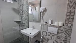 Koupelna v ubytování Hotel Luciano