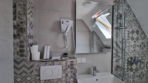 Koupelna v ubytování Hotel Luciano