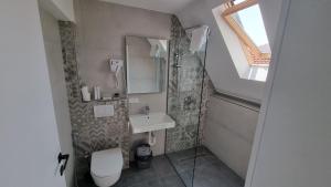Koupelna v ubytování Hotel Luciano