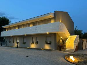 a large building with stairs in front of it at Residence Diamante in Villorba