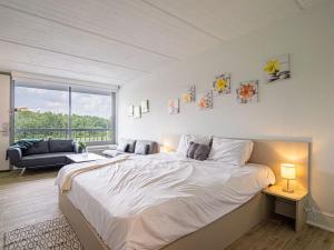 a bedroom with a large bed and a large window at Luxury Orlando Condo Next to Disney with lake view in Kissimmee +29 photos
