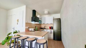 Η κουζίνα ή μικρή κουζίνα στο Logement lumineux 10min Disney