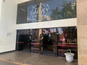 a store front with a sign on the side of a building at Garvey Park Hotel - Ap 510 ou 512 in Brasilia