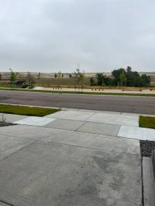 an empty parking lot with a street and a road at A cozy house in Parker, Colorado in Parker