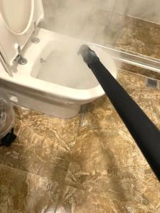 a black umbrella sitting next to a toilet in a bathroom at Panoramik deniz manzaralı dubleks in Adalar +28 photos