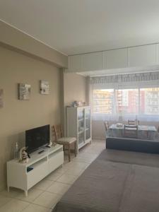 TV a/nebo společenská místnost v ubytování Apartamento ARMAÇÃO PÊRA