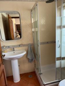 a bathroom with a sink and a shower at Nature House Almograve - Double Room with terrace and private bathroom - Fishermen's Trail in Almograve +15 photos