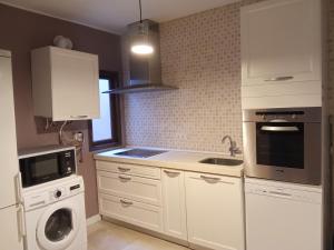 Kuchyň nebo kuchyňský kout v ubytování Apartamentos "Casa Melé" 2