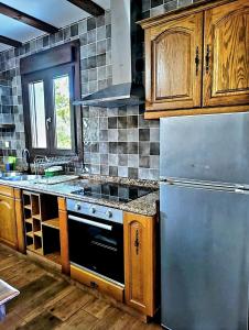 Kuchyň nebo kuchyňský kout v ubytování Vivienda María Lourdes