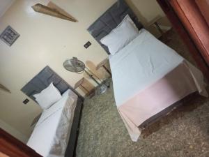 an overhead view of two beds in a bedroom at Maison coco in Marrakesh