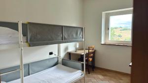 Postel nebo postele na pokoji v ubytování S214 - Sirolo, trilocale con giardino in zona tranquilla