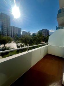 a balcony with a view of a city at El Hogar - Sucursal América - Edificio Ferrara 1228 con Garaje cubierta in Cochabamba