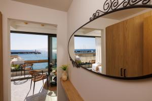 a room with a large mirror on the wall at Soho SeaFront Suites in Hersonissos +54 photos