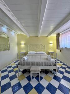 A bed or beds in a room at CASSIODORO SUITE B&B