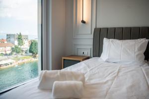 Postel nebo postele na pokoji v ubytování Hotel Luciano