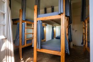 Postel nebo postele na pokoji v ubytování Take it Easy Hostel