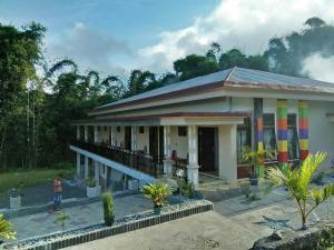 a house with a rainbow on the side of it at New Bintang By Four-G in Bajawa