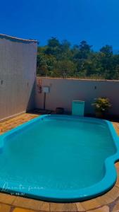 a large blue pool sitting on top of a building at La Luna dos Pireneus - Pousada in Pirenópolis