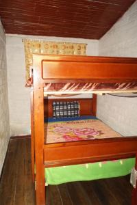Postel nebo postele na pokoji v ubytování Hostal La Rosita