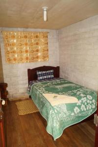 Postel nebo postele na pokoji v ubytování Hostal La Rosita